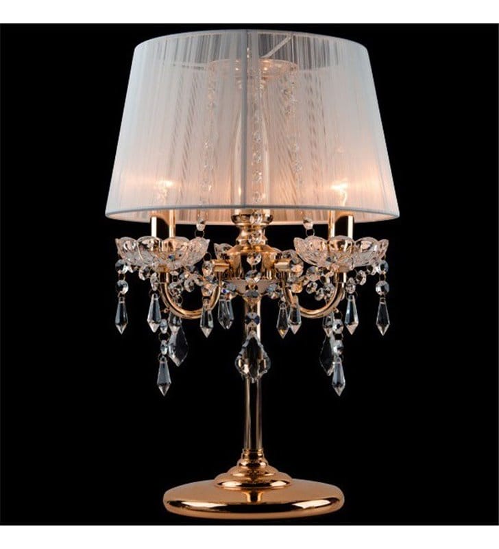 Stylowa złota lampa stołowa Izabel potrójna kryształowa z białym abażurem